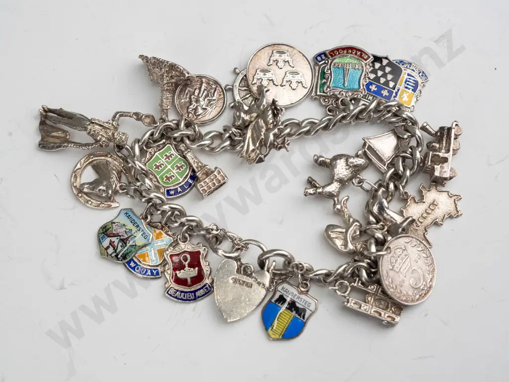 silver charm bracelet stamped silver on clasp - some charms stamped Image 1++