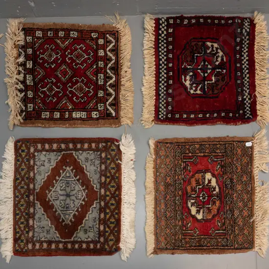 4 small Persian style hand-knotted wool rug pieces in varying patterns - largest is 320 x 320. One has some fading.