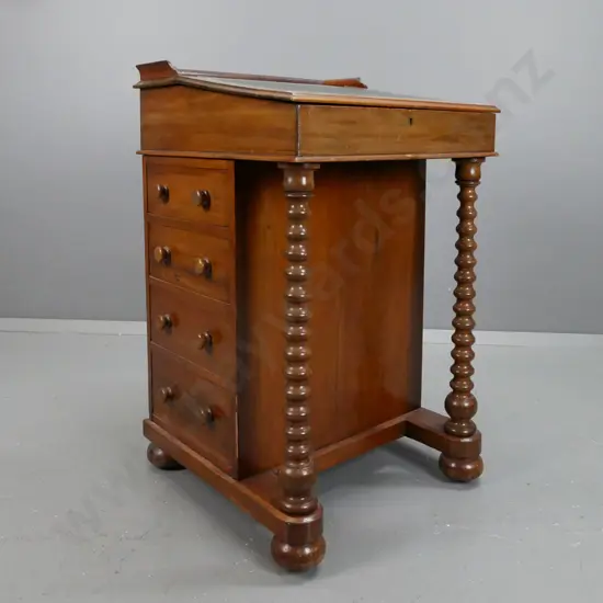 New Zealand colonial kauri and rimu davenport desk with gold tooled green leather insert,