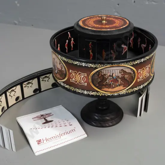 Hemisferium reproduction praxinoscope moving picture device with spinning gallery, viewing mirrors and assorted paper