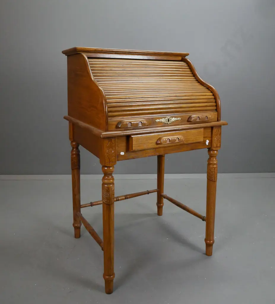 reproduction Victorian style oak wave roll top desk on turned stand with turned stretcher base. Brass label pull Image 1++