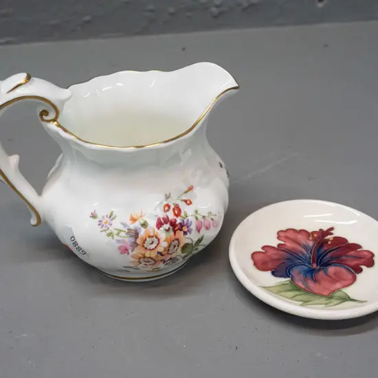 Moorcroft pin dish - some crazing - and a Royal Crown Derby posies jug with gilt decoration H-100