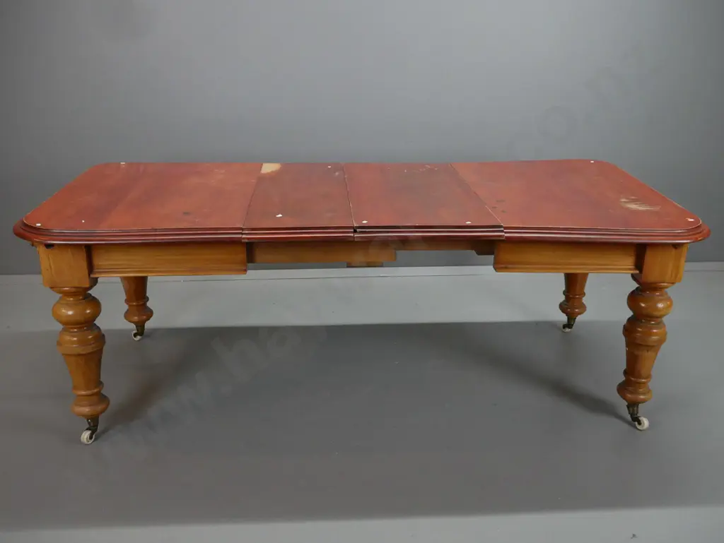 New Zealand colonial rimu turned leg wind out table, on white china cup casters. Has borer in the top Image 1++