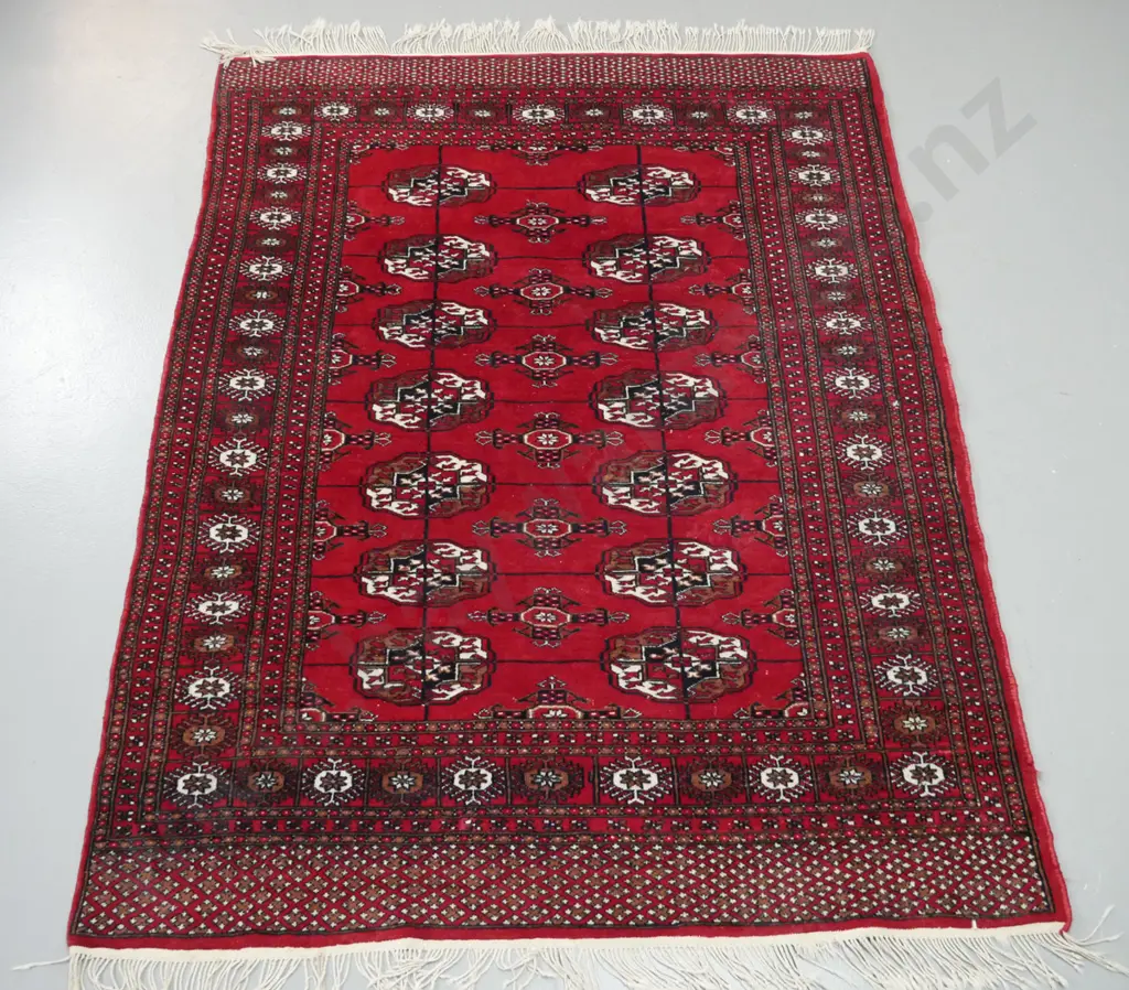 Turkoman style hand knotted wool floor rug - dark red, black, brown and ivory - some wear and some loss to fringe Image 1++