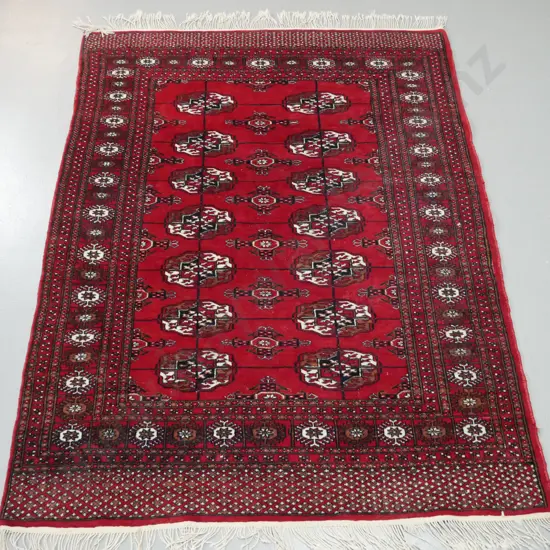 Turkoman style hand knotted wool floor rug - dark red, black, brown and ivory - some wear and some loss to fringe