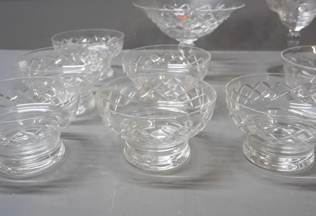assorted cut and etched crystal items, all but one marked Stuart - 6 matching footed bowls, 2 comports, taller is H-130 Image 1++