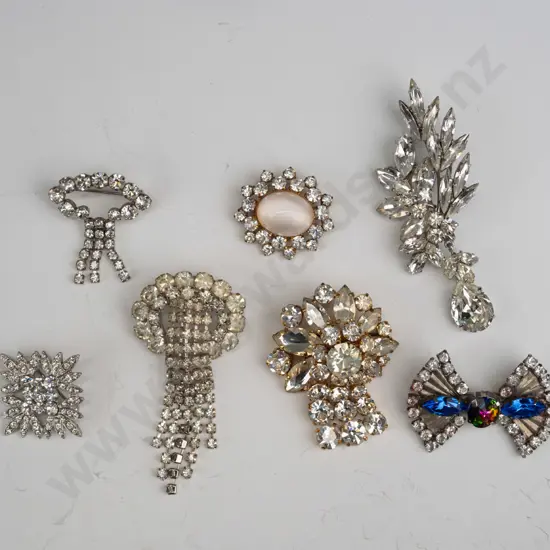 7 costume brooches