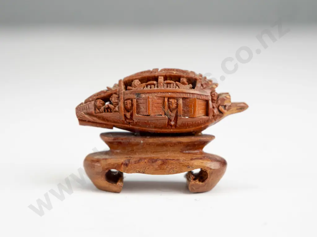 Chinese intricately carved fruit stone or pit, carved into boat shape with movable doors, mounted on wooden stand. Seems Image 1++