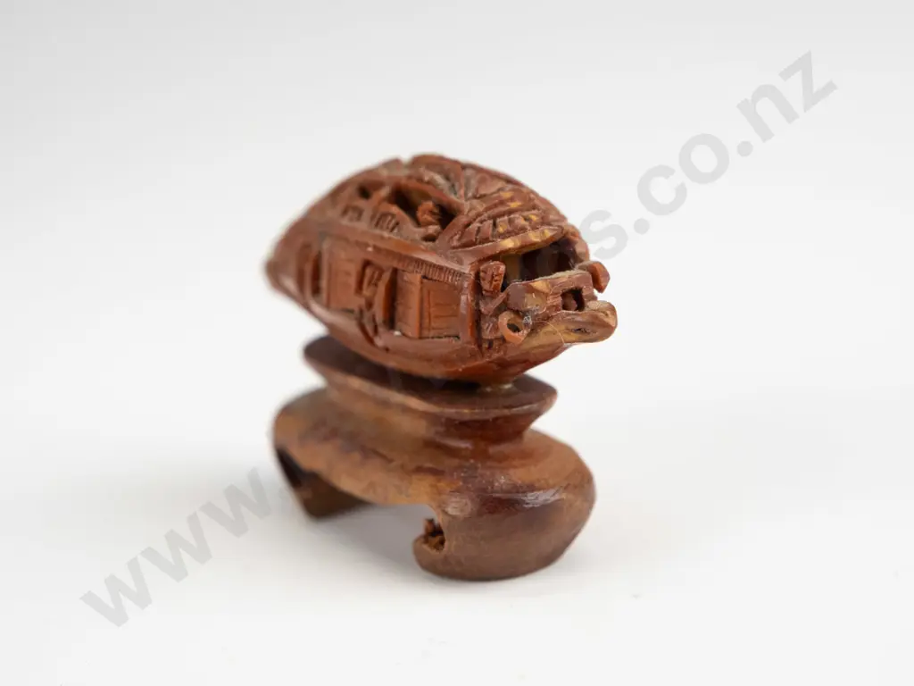 Chinese intricately carved fruit stone or pit, carved into boat shape with movable doors, mounted on wooden stand. Seems Image 1++