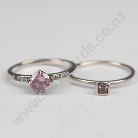 2 silver pink stone rings both stamped 925 Round size O Square size P