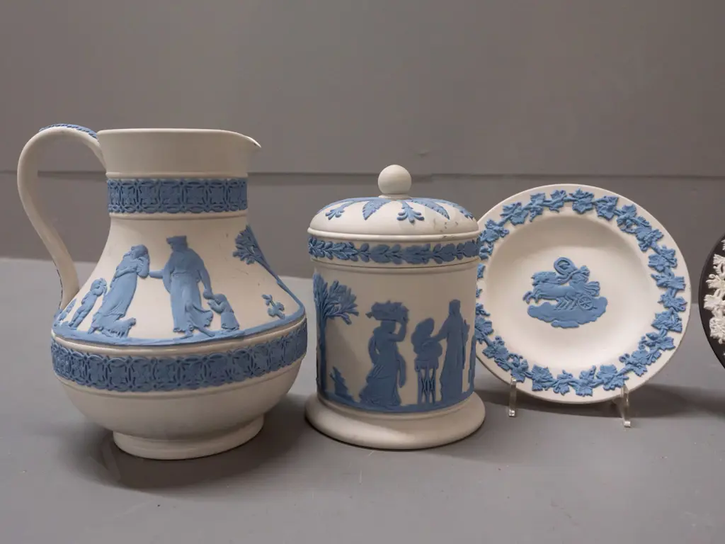 4 pieces of Wedgwood jasperware - 3 are blue on white ground, one black & white. Jug is H-135 Image 1++