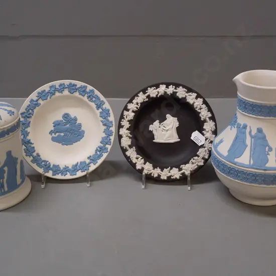 4 pieces of Wedgwood jasperware - 3 are blue on white ground, one black & white. Jug is H-135