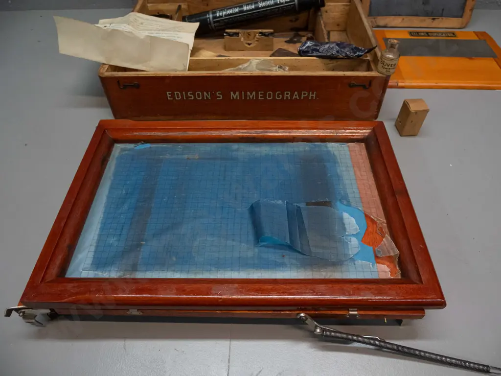 vintage Edison Mimeograph in elm case with hinged lid, assorted attachments, parts and ink from an Ellams Duplicator etc Image 1++