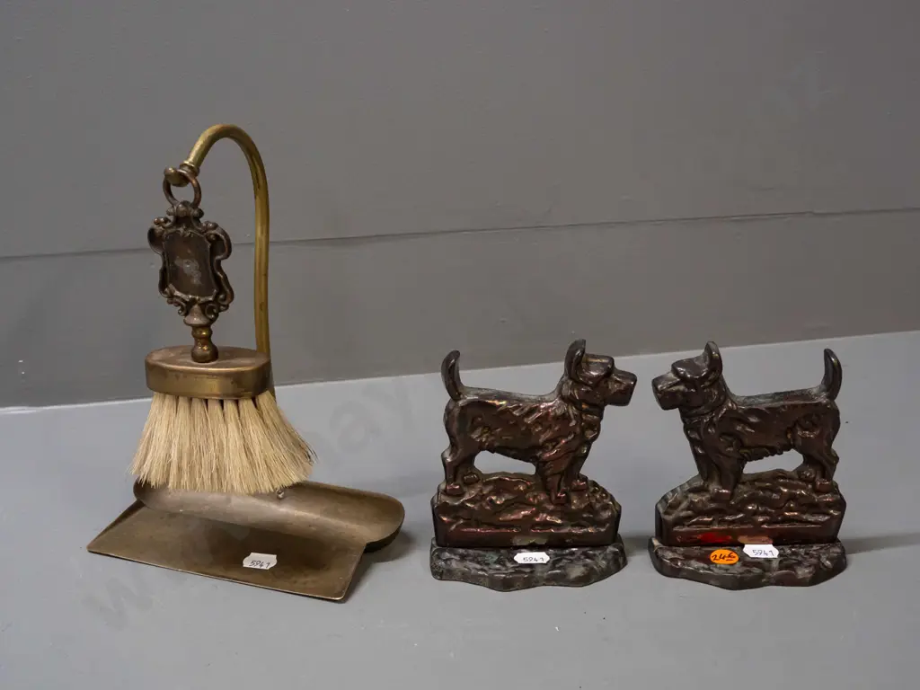 pair of cast metal Scottie dog book-ends with copper lustre finish and a crumb tray with hanging brush, may be missing Image 1++