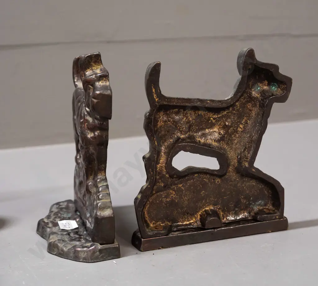 pair of cast metal Scottie dog book-ends with copper lustre finish and a crumb tray with hanging brush, may be missing Image 1++