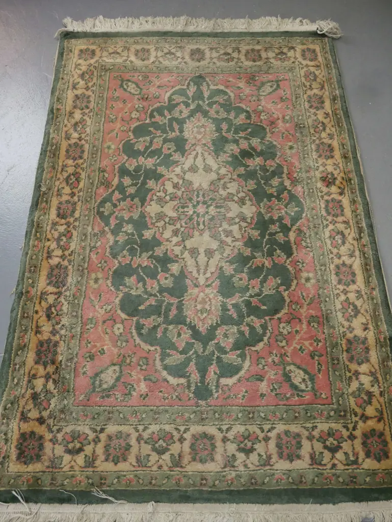 floor rug, green & pink ground w/ central medallion & floral borders. Some fading staining & fraying. W-1480 D-920 Image 1++