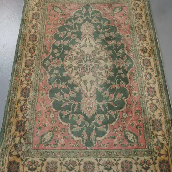 floor rug, green & pink ground w/ central medallion & floral borders. Some fading staining & fraying. W-1480 D-920