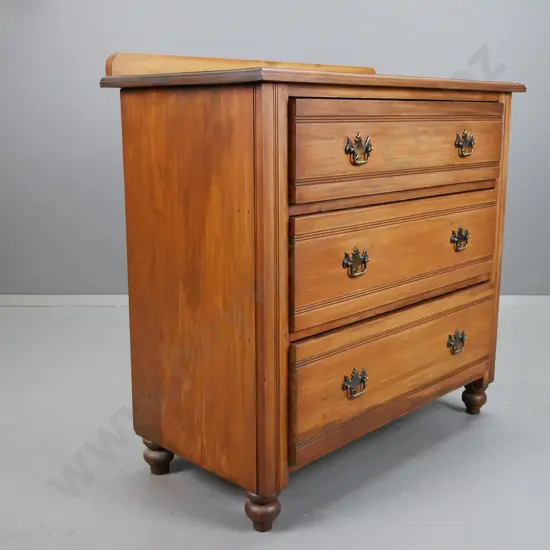 colonial rimu 3 drawer chest on turned bun feet with replacement brass handles, slight borer to top