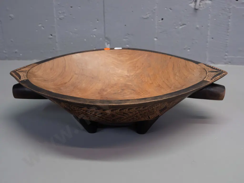 carved hardwood food bowl with bands of Pacific island style decoration, 4 feet, handles at ends - some discolouration Image 1++