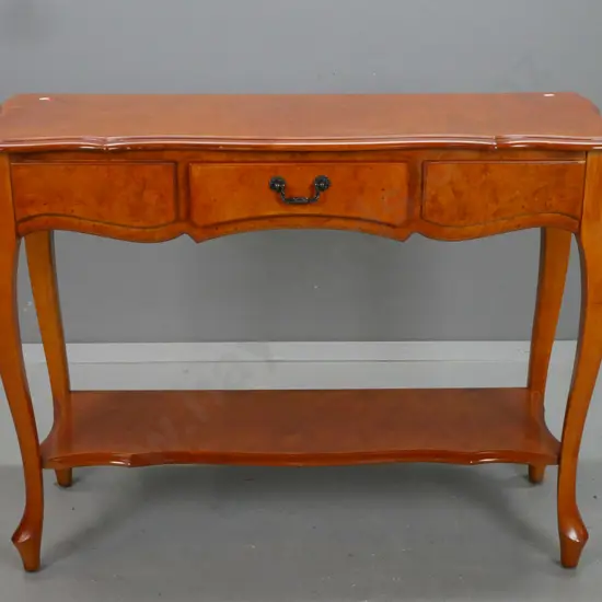 walnut veneer cab-leg hall table with shaped top, single drawer, bottom shelf, with Mitchells Christchurch label inside