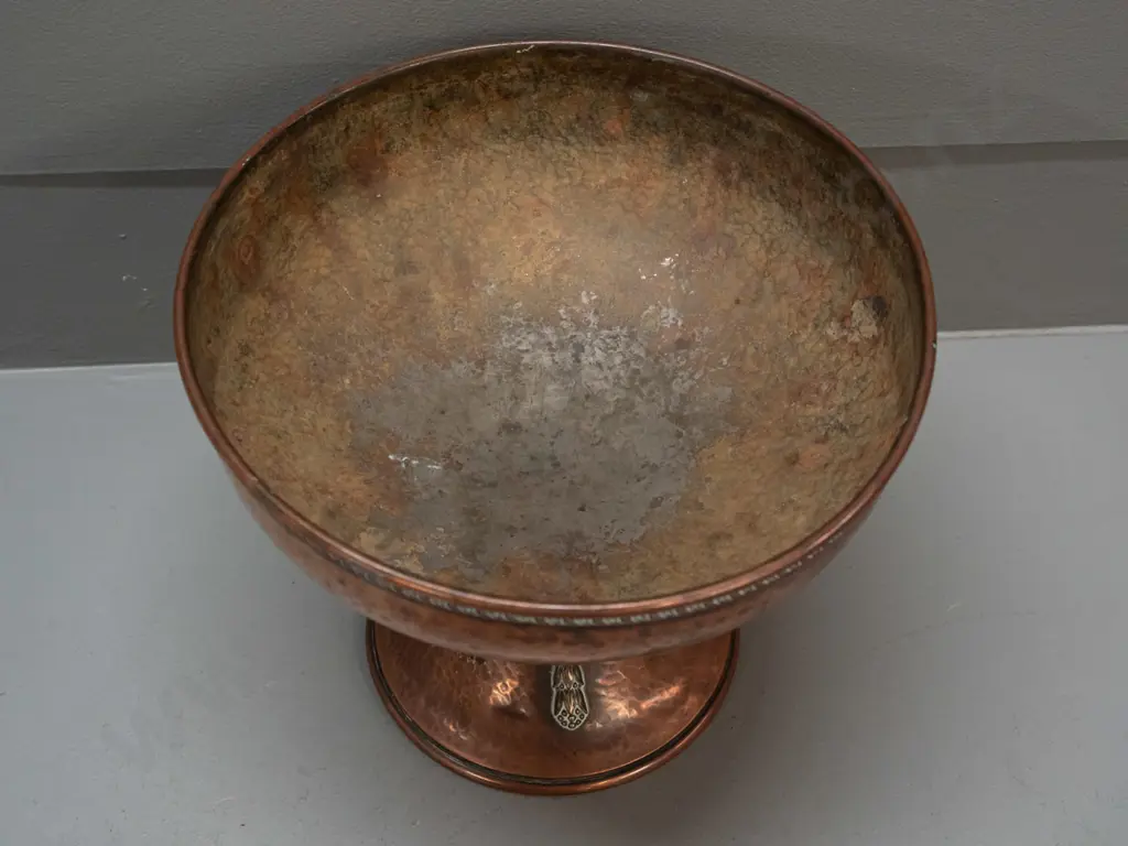 hand beaten copper comport with applied decoration on stem, remnant worn plating or lining to interior, has a few dents Image 1++