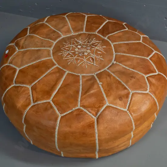 leather pouffe with hand stitched decoration, zip in bottom, geometric shaped panels - wear to top