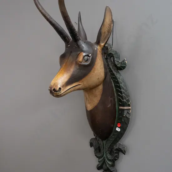 Black Forest carved wood chamois head, with real horns, on foliate carved shield backing board - some cracks and paint