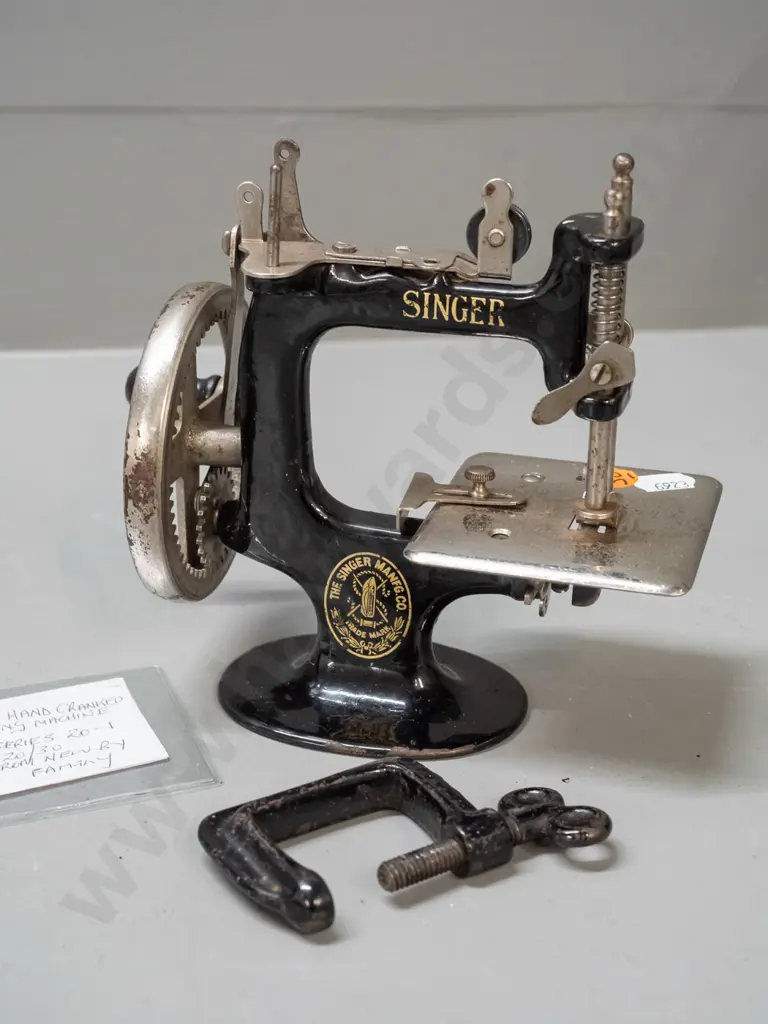 Singer miniature hand-crank sewing machine with bench clamp - pitting to chrome and chips to black enamel, wear to Image 1++