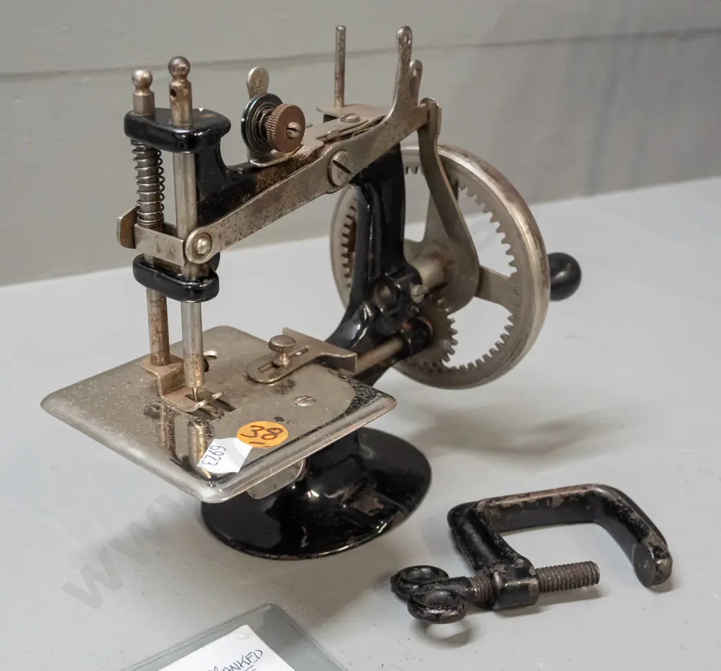 Singer miniature hand-crank sewing machine with bench clamp - pitting to chrome and chips to black enamel, wear to Image 1++