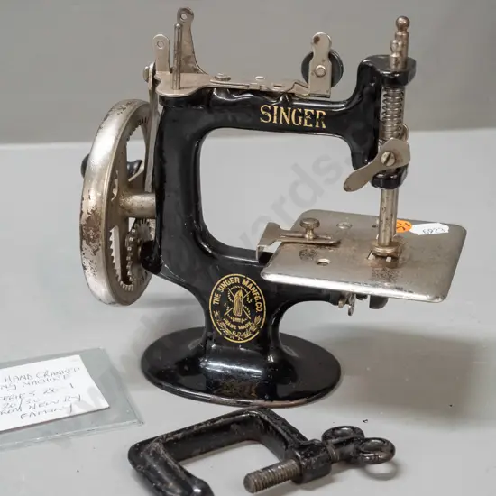 Singer miniature hand-crank sewing machine with bench clamp - pitting to chrome and chips to black enamel, wear to