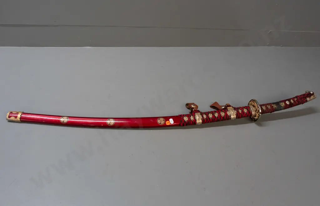 decorative reproduction Japanese sword w/ red and black cloth binding, gold and silver-colour alloy fittings, stainless Image 1++