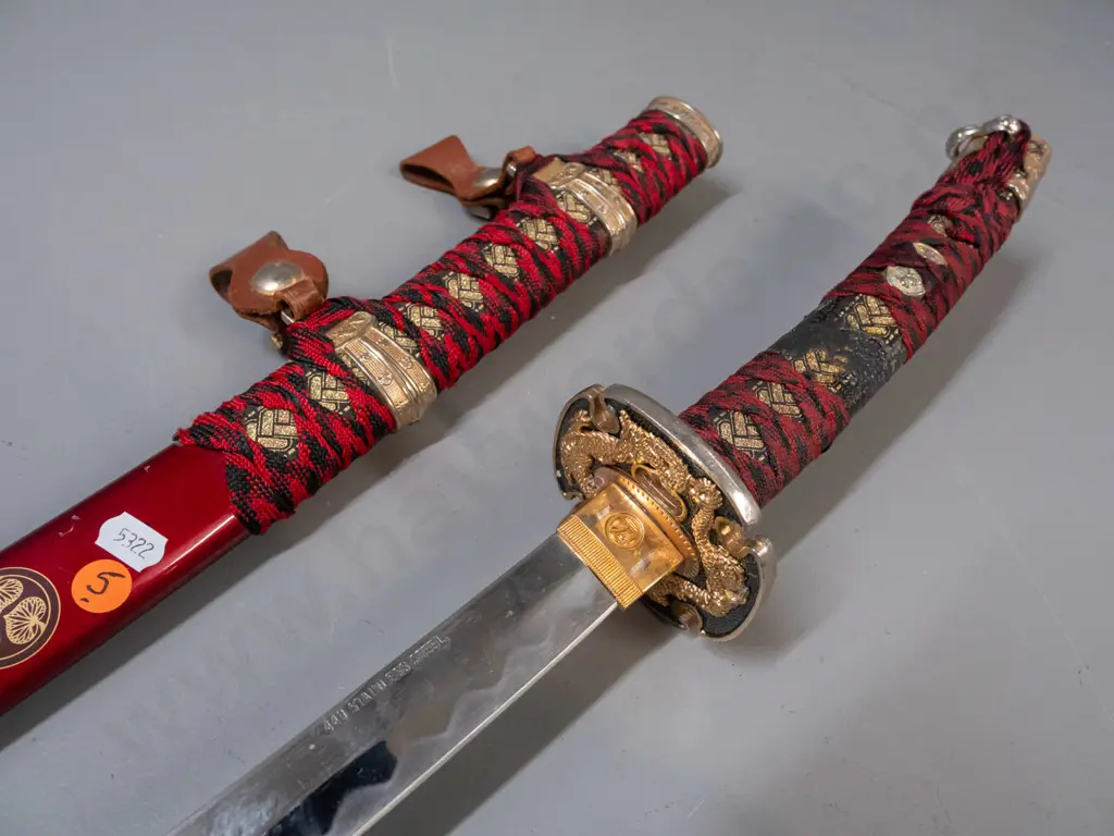 decorative reproduction Japanese sword w/ red and black cloth binding, gold and silver-colour alloy fittings, stainless Image 1++