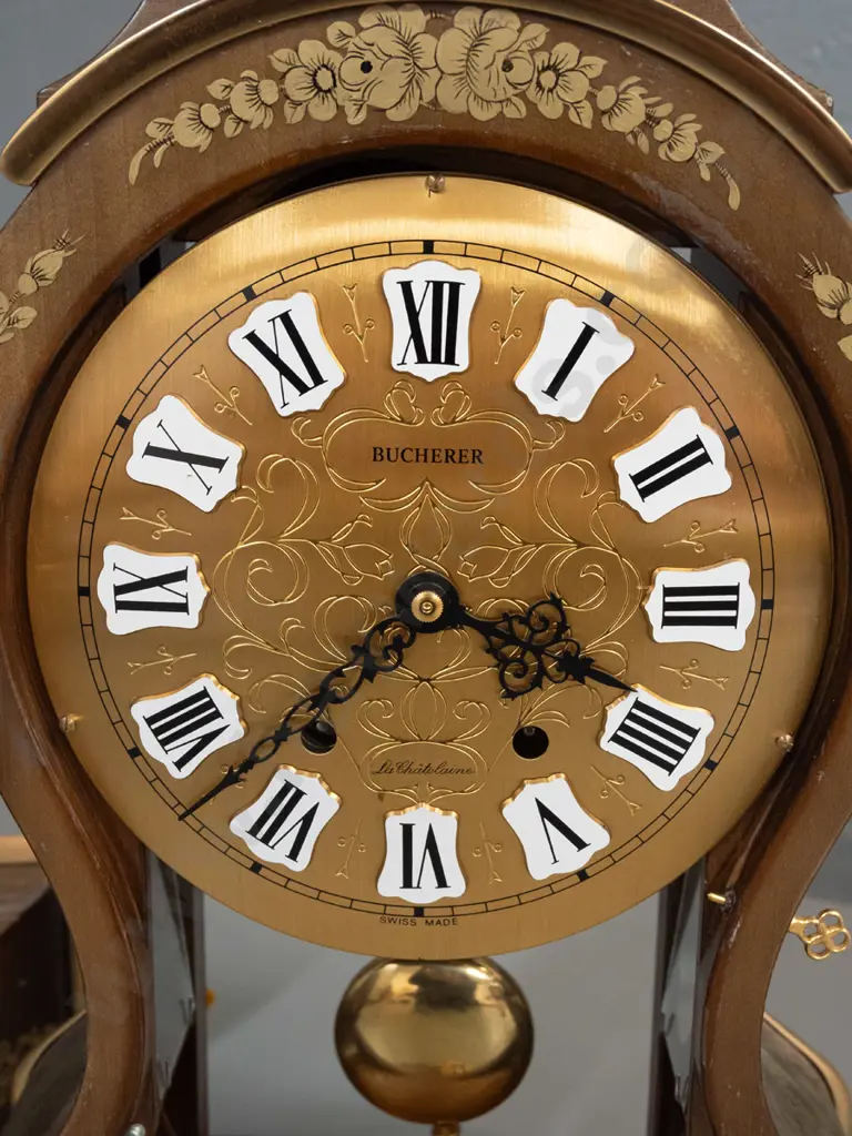 rococo style bracket clock in walnut case with gilded brass feet and decoration, floral transfers, glazed door and sides Image 1++