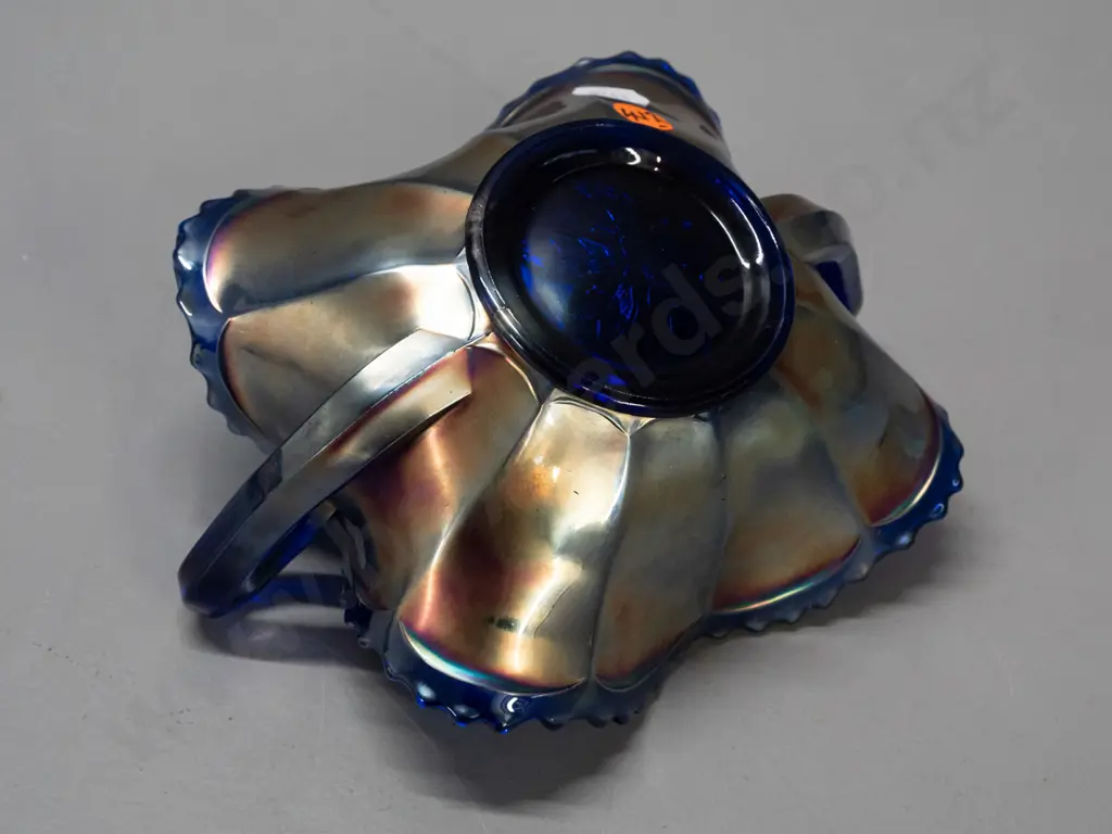 small cobalt blue carnival glass bowl - handled leaf shape, with grape leaf motifs H-80 W-180 across handles Image 1++