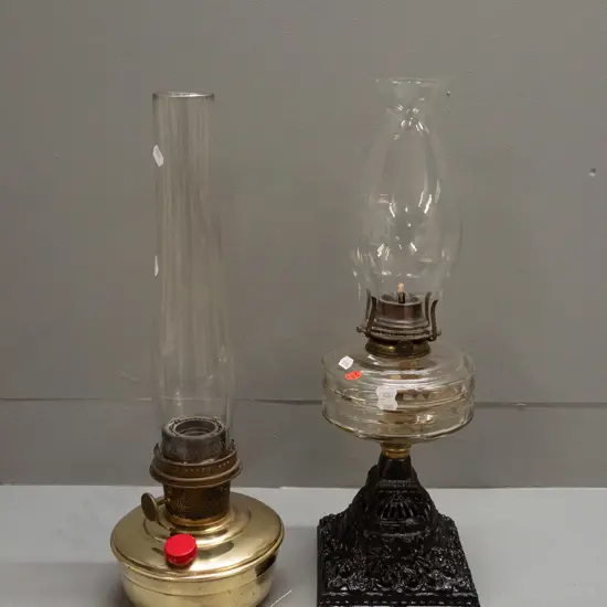 2 vintage kerosene lamps - table lamp with cast metal base, ribbed clear glass tank, Victor & E. MIller USA markings,