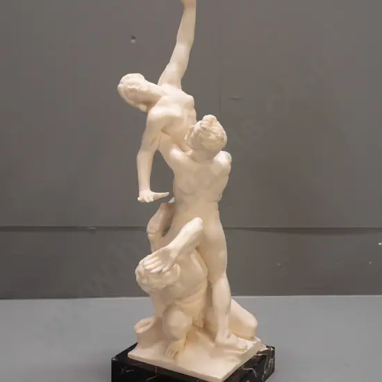 composite group of 3 classical style figures on black veined marble base - figure marked G Ruggeri - has had repair to