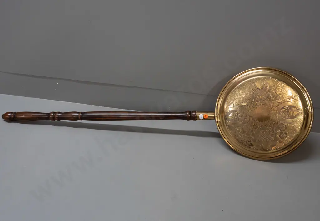 brass bed-warmer with turned wooden handle, etched decoration on lid - handle a little loose, some discolouration to lid Image 1++