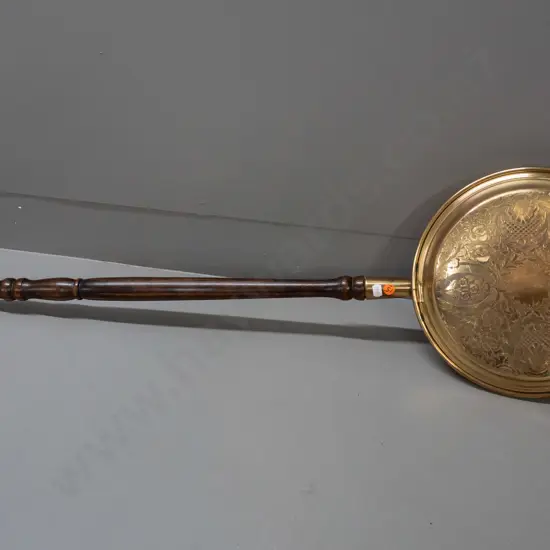 brass bed-warmer with turned wooden handle, etched decoration on lid - handle a little loose, some discolouration to lid
