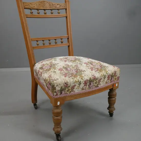 kauri and rimu colonial bedroom chair, turned gallery to back, reeded back supports, floral upholstered