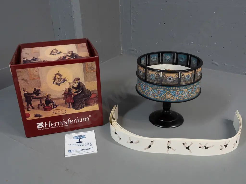 Hemisferium reproduction zoetrope moving picture device with spinning gallery and assorted paper animation image strips Image 1++