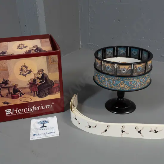 Hemisferium reproduction zoetrope moving picture device with spinning gallery and assorted paper animation image strips