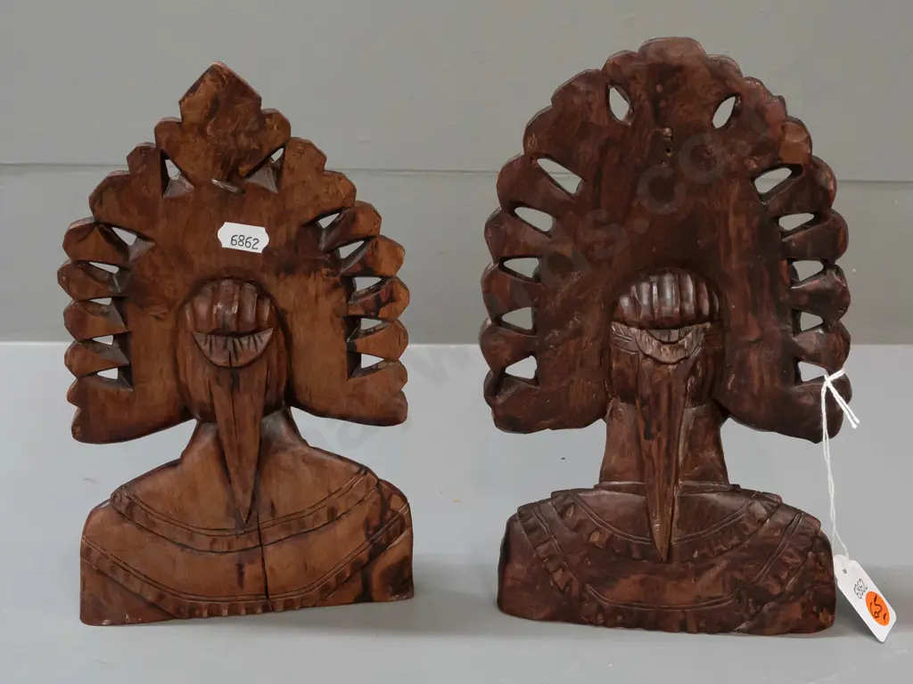 2 carved Indonesian hardwood busts with pierced edges - one with wall hanging eyelet in back - both with a few small Image 1++