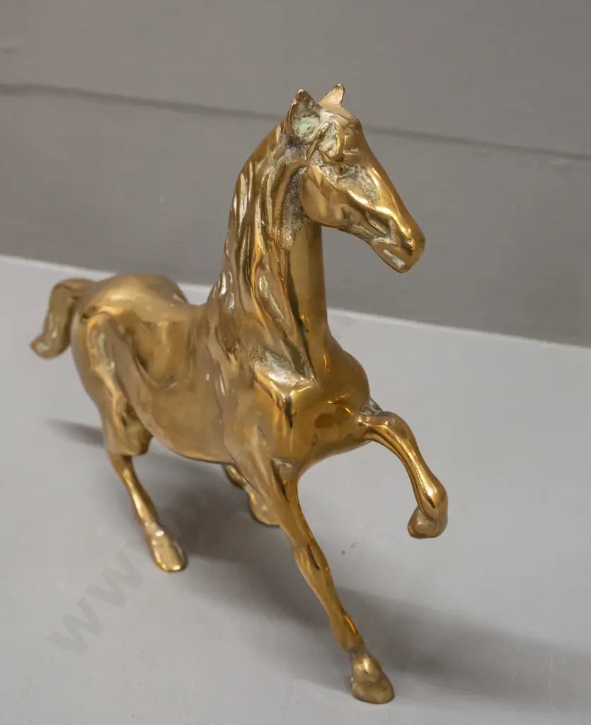 polished cast brass horse figure with one foot raised H-200 L-210 Image 1++