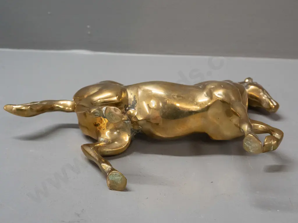 polished cast brass horse figure with one foot raised H-200 L-210 Image 1++