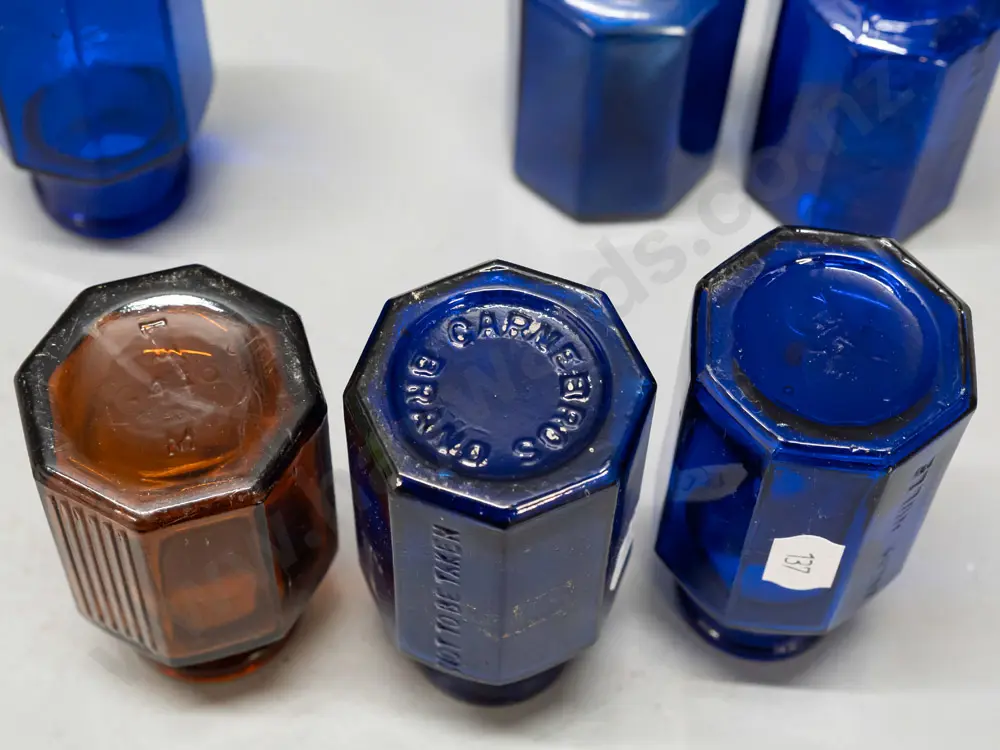 6 glass hexagonal faceted bottles, 4 cobalt blue and the amber bottle marked Strychine - Not to be Taken - Image 1++