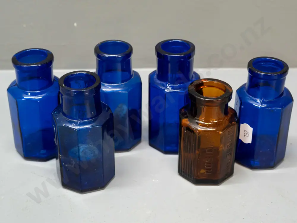 6 glass hexagonal faceted bottles, 4 cobalt blue and the amber bottle marked Strychine - Not to be Taken - Image 1++