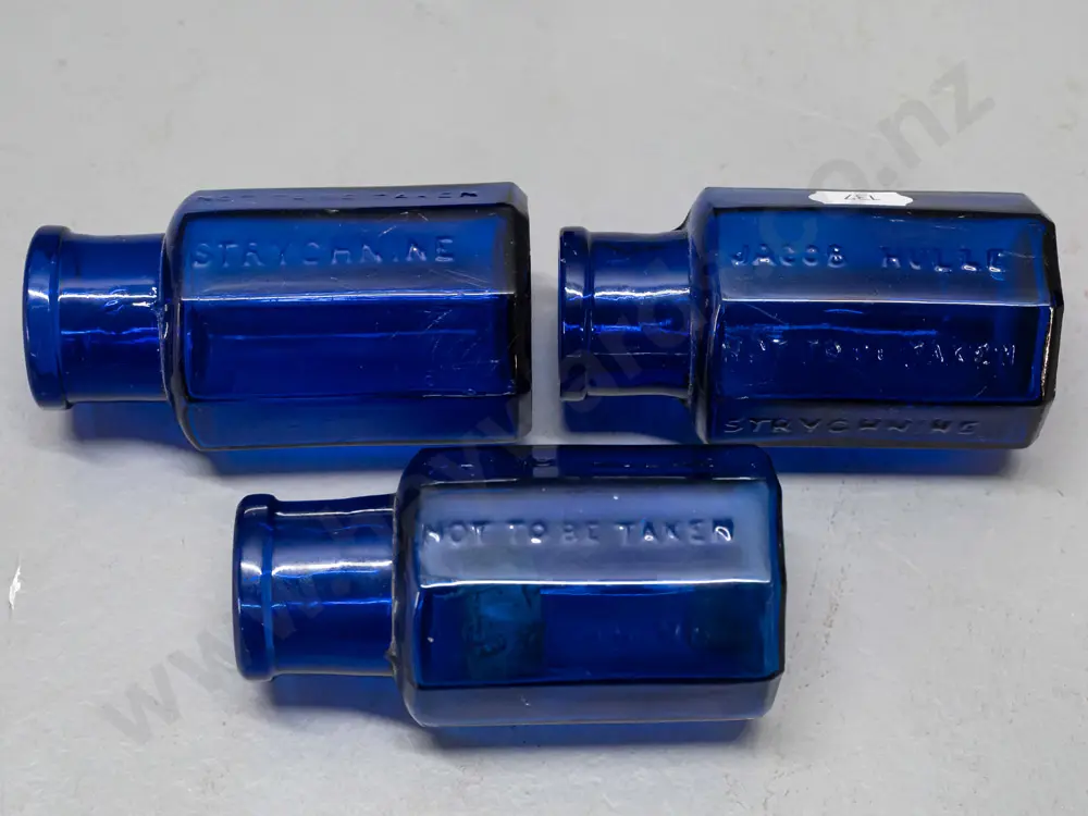 6 glass hexagonal faceted bottles, 4 cobalt blue and the amber bottle marked Strychine - Not to be Taken - Image 1++