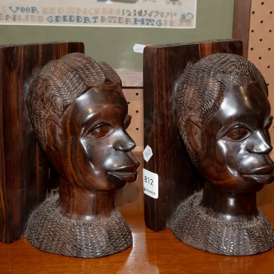 pair of African hardwood [rosewood?] carved bust bookends H-180 W-240 [together]