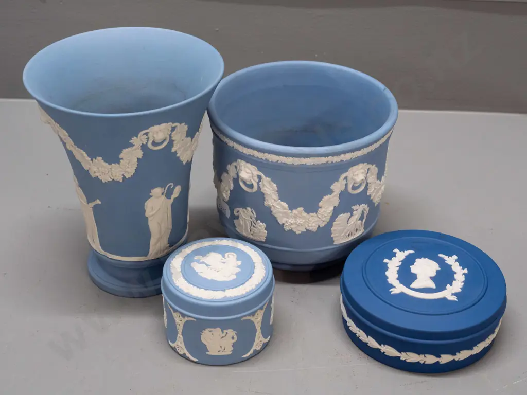 4 pieces of blue Wedgwood jasper ware including 2 lidded trinkets, one is dark blue 1977 Silver Jubilee. Larger vase is Image 1++