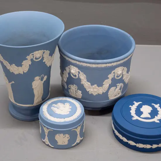 4 pieces of blue Wedgwood jasper ware including 2 lidded trinkets, one is dark blue 1977 Silver Jubilee. Larger vase is